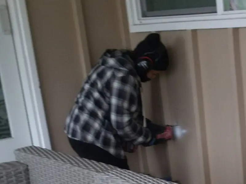 Professional electrician installing an exterior outlet in Greece